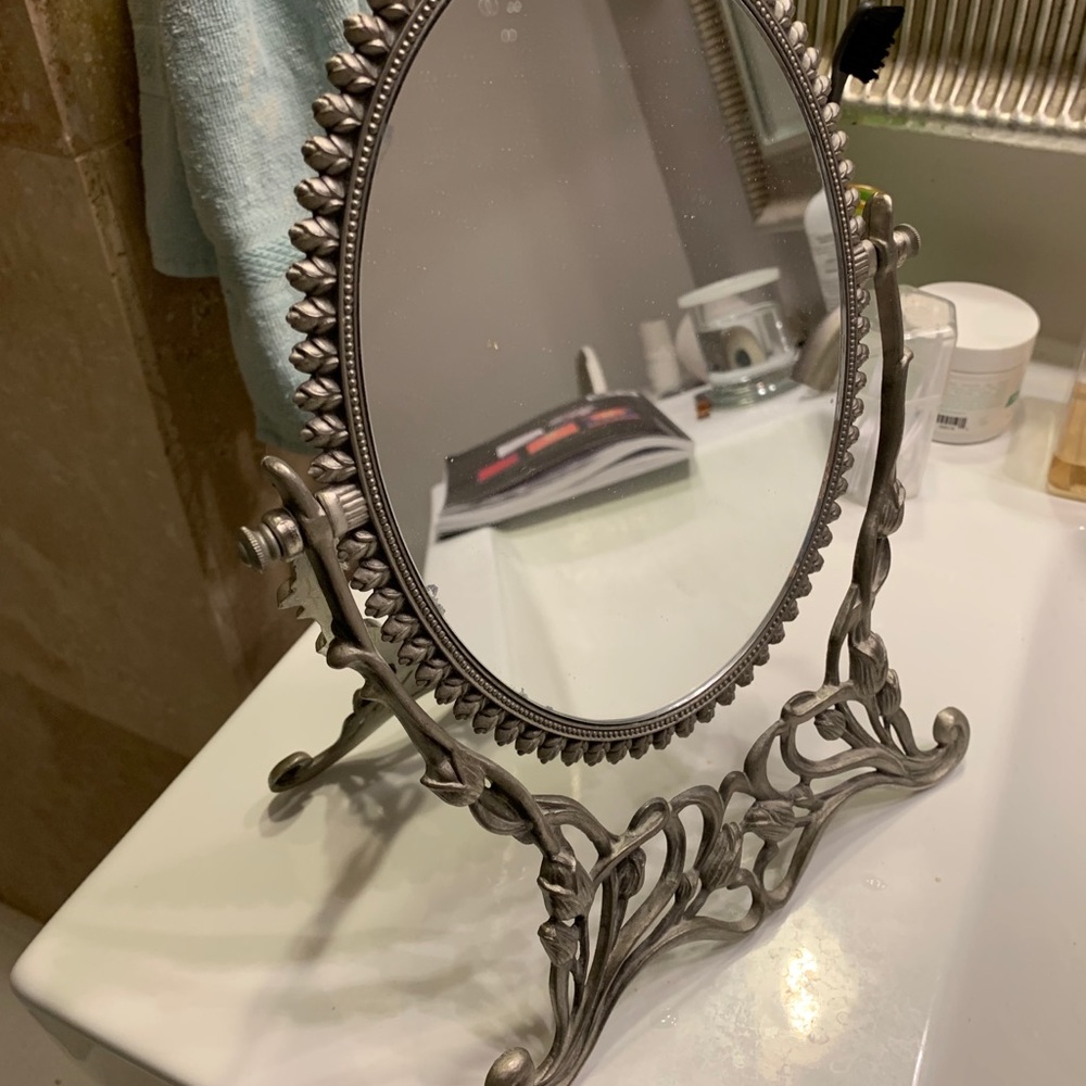 Intricate silver floral mirror